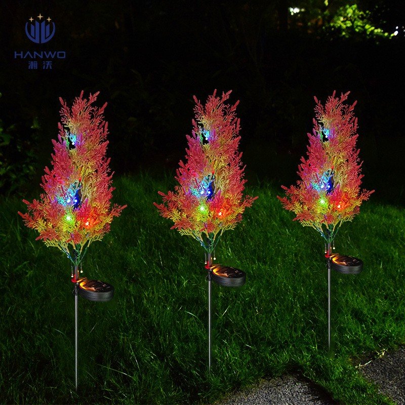 Multi-color cypress plume solar garden stakes on a lawn