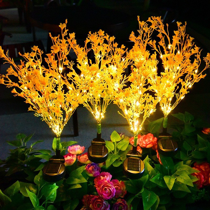 Warm wheat-ear style solar garden lights among foliage